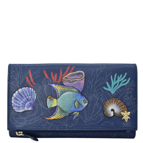 Anuschka style 1136, Handpainted Three Fold Clutch. Mystical Reef painting in Blue color. Featuring Snap button entry and many credit card slots.
