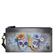 Load image into Gallery viewer, Anuschka style 1151, handpainted Clutch Organizer Wristlet. Calaveras de Azucar painting in black color. Featuring Rear six credit card holders with RFID protection.
