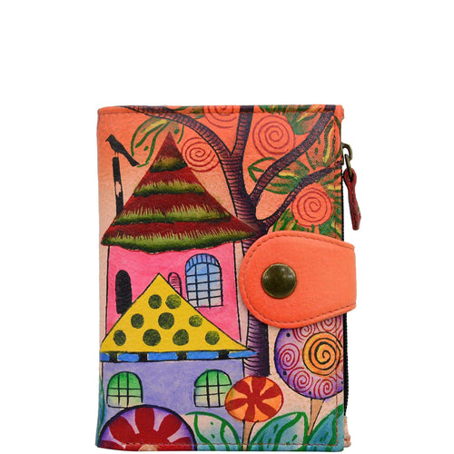 Anna by Anuschka style 1700, handpainted Ladies Wallet. Village Of Dreams painting in Orange color. Featuring full length bill pockets, eight credit card pockets, four multi purpose pockets and zippered coin pocket.