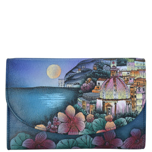 Anuschka style 1816, handpainted Ladies Tri Fold Wallet. Moonlit Amalfi painting in Blue color. Featuring one zippered compartment, two open bill compartment and thirteen card slots with one ID window.