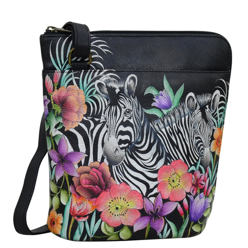 Anuschka style 493, handpainted Organizer Crossbody With Extended Side Zipper. Playful Zebras Painted in Black Color. Featuring inside zippered partition pocket, zippered back wall pocket Multi-purpose pocket, two penholders and pullout credit card/ ID holder.