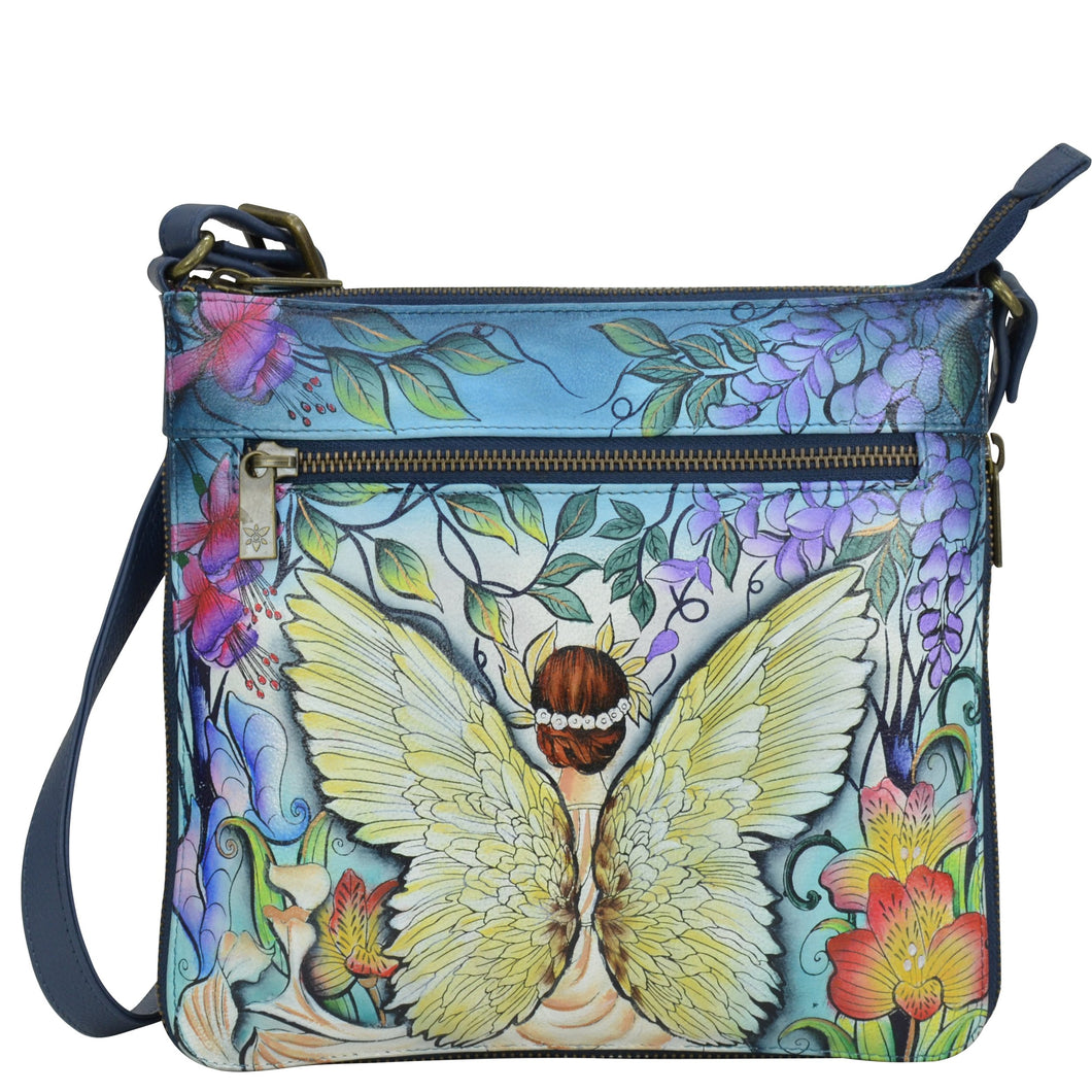 Anuschka style 550, handpainted Expandable Travel Crossbody. Enchanted Garden Painted in Blue Color. Featuring inside one full length zippered wall pocket, one open wall pocket, two multipurpose pockets.