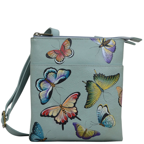 Anuschka style 596, RFID Blocking Triple Compartment Travel Organizer. Butterfly Heaven painting in Green or Mint Color. Featuring RFID blocking and many credit card slots.