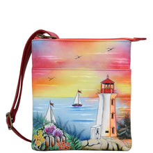 Load image into Gallery viewer, Anuschka style 596, handpainted RFID Blocking Triple Compartment Travel Organizer. Guiding Light Painted in Orange Color. Featuring inside one full length zippered pocket, one open wall pocket and four RFID protected credit card holder.
