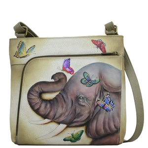 Anuschka style 651, handpainted Crossbody With Front Zip Organizer. Gentle Giant Painted in Multi Color. Featuring front zippered RFID protected organizer chamber with gusset contains four card holder, two pen holders, one ID window and one slip in pocket.