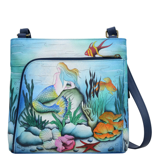 Anuschka style 651, handpainted Crossbody With Front Zip Organizer. Little Mermaid Painted in Blue Color. Featuring front zippered RFID protected organizer chamber with gusset contains four card holder, two pen holders, one ID window and one slip in pocket.