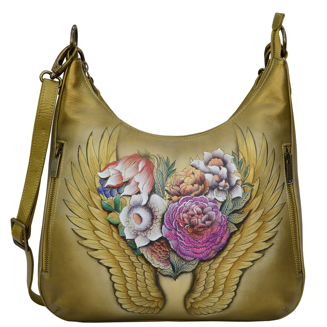 Anuschka style 662, handpainted Convertible Slim Hobo With Crossbody Strap, Angel Wings painting in tan color. Featuring  two multipurpose pockets with gusset. slip in cell pocket.