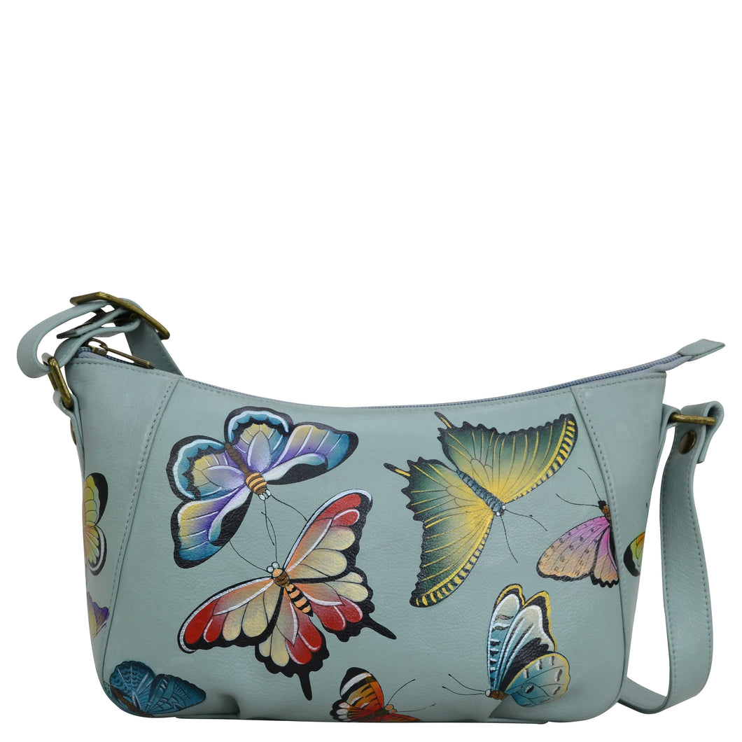 Anuschka style 670, Everyday Shoulder Hobo, Butterfly Heaven painting in Green or Mint Color. Featuring Rear full length zippered pocket & Adjustable shoulder strap.