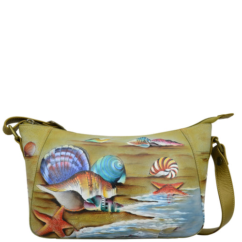 Anuschka style 670, handpainted Everyday Shoulder Hobo. Gift of the Sea Painted in Multi Color. Featuring inside one zippered wall pocket, two multipurpose pockets, rear full length zippered pocket with adjustable shoulder strap.