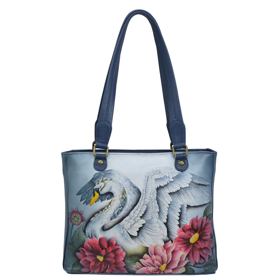 Anuschka style 677, handpainted Medium Shopper. Swan Song Painted in Multi Color. Featuring one open wall pocket, two multipurpose pockets with gusset.