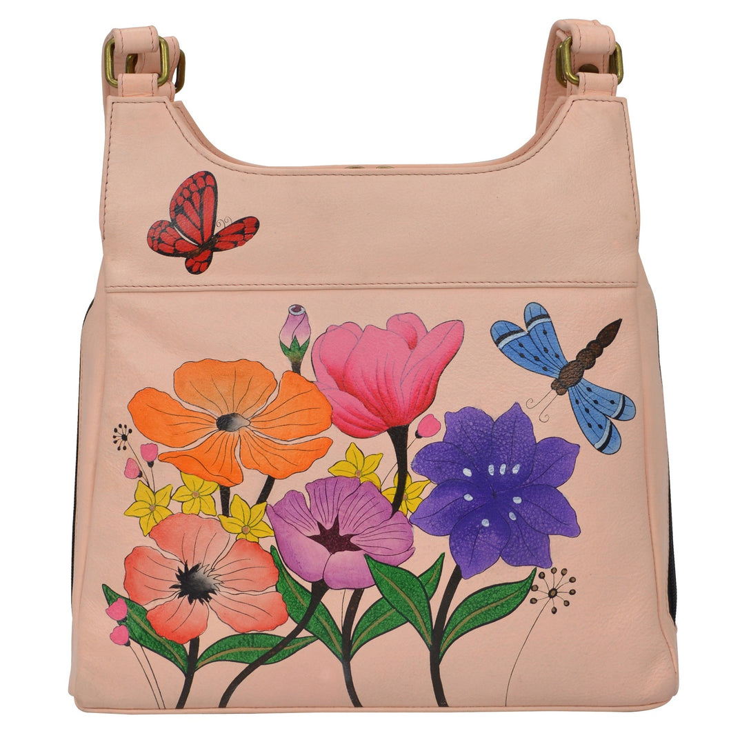 Anna by Anuschka style 7001, handpainted Triple Compartment Satchel. Dragonfly Garden painting in pink/peach color. Featuring two full length outside compartments with magnetic closure and fits Fits tablet and E-Reader.