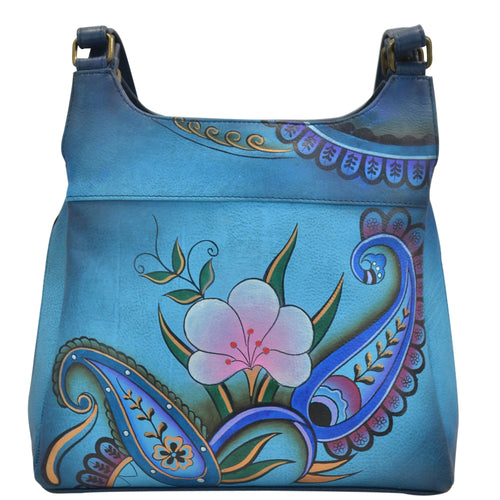 Anna by Anuschka style 7001, handpainted Triple Compartment Satchel. Denim Paisley Floral painting in blue color. Featuring two full length outside compartments with magnetic closure and fits Fits tablet and E-Reader.