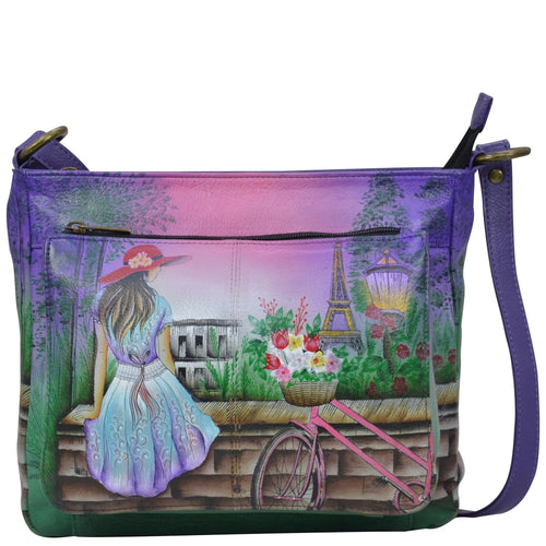 Anna by Anuschka style 8207, handpainted Medium Crossbody. Paris Sunrise painting in multi color. Featuring inside one full length zippered wall pocket, two multipurpose pockets, Fits E-Reader, Fits tablet.