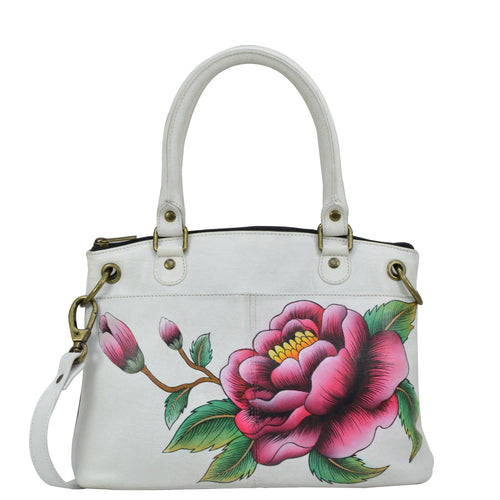 Anna by Anuschka style 8252, handpainted Small Satchel. Peony-Ivory painting in white/ivory color. Featuring inside one zippered wall pocket, two multipurpose pockets, Fits E-Reader, Fits tablet, Removable strap.