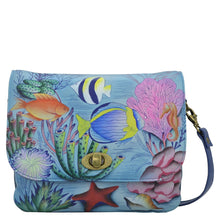 Load image into Gallery viewer, Anna by Anuschka style 8428, handpainted Triple Compartment Flap Crossbody. Treasures of the Reef painted in Blue color. Featuring inside one zippered wall pocket, two multipurpose pockets with gusset and two multi purpose gusseted pockets with removable adjustable strap.
